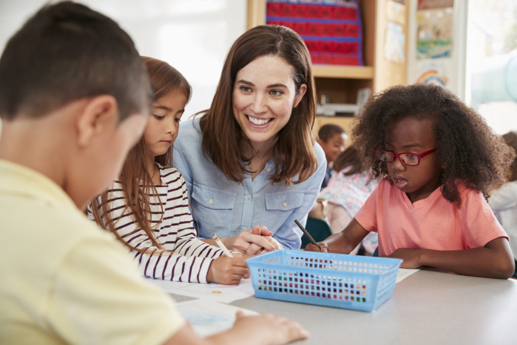 What you need to know about early intervention/children sitting at desk in classroom