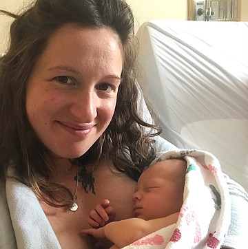 Woman holding newborn.