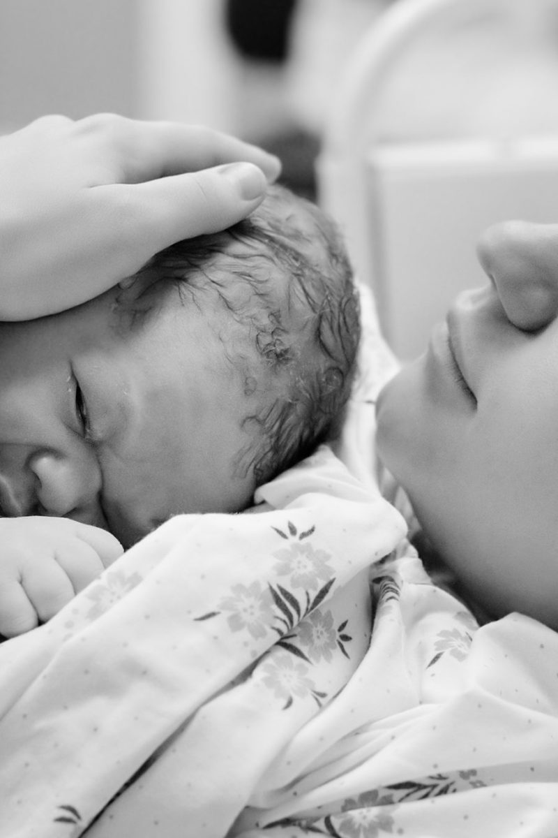 Mom with newborn baby right after delivery