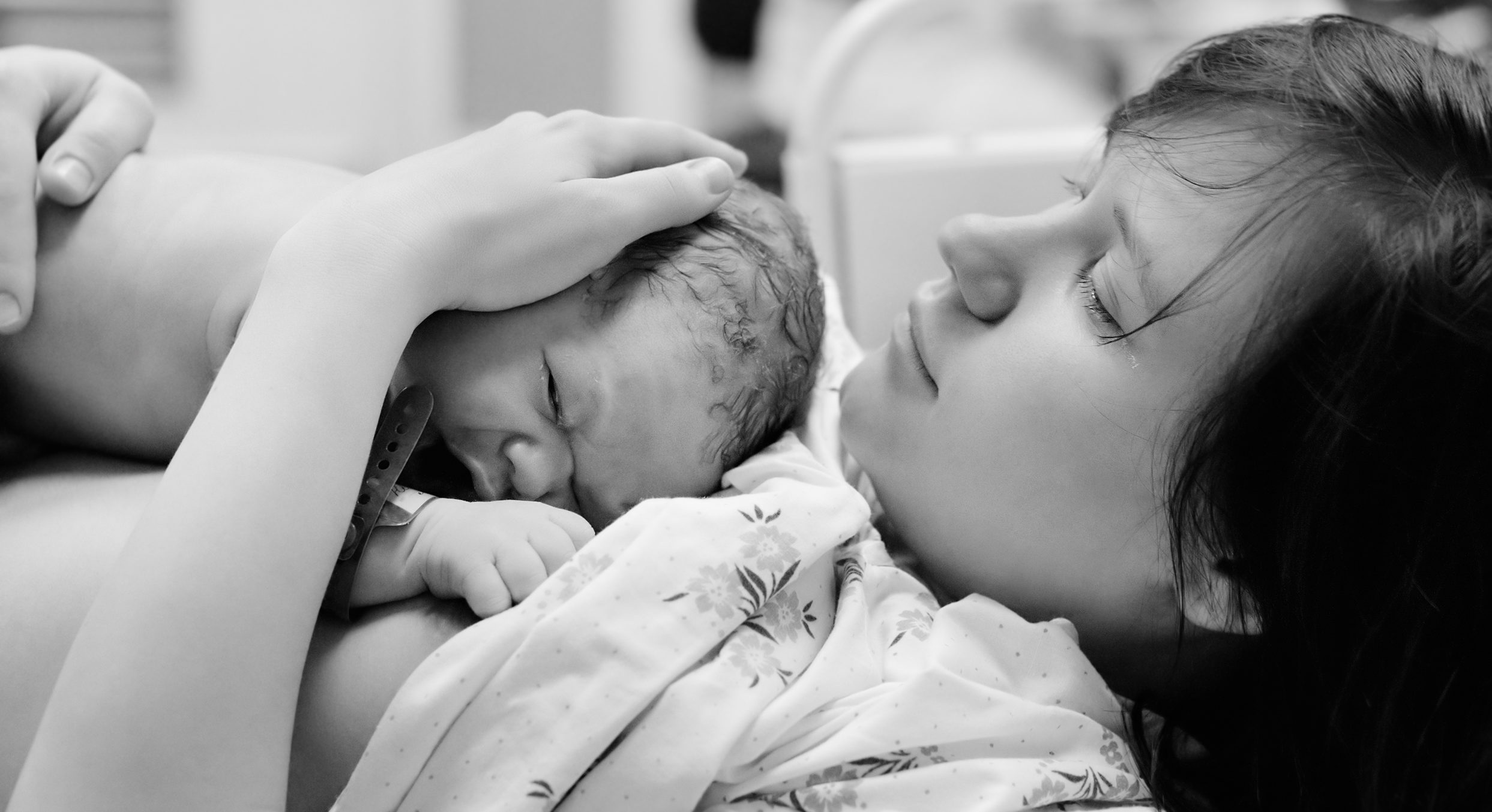 Mom with newborn baby right after delivery