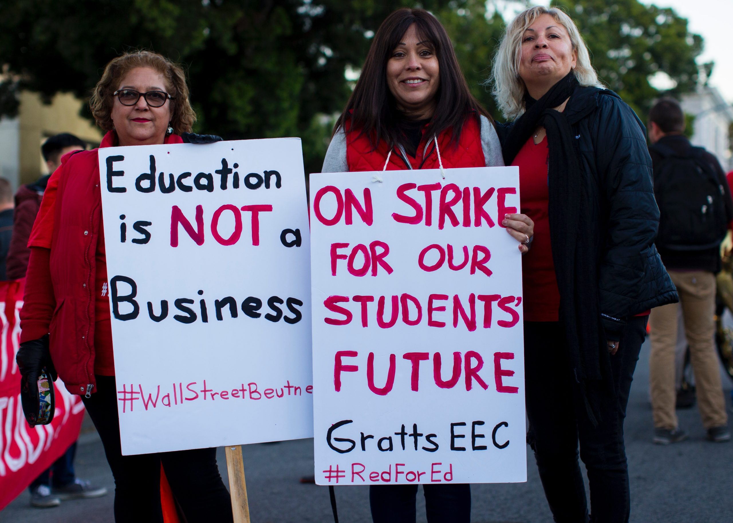 Three women protesting during the LAUSD strike