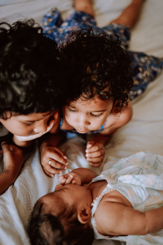 Siblings with new baby, who they love, but displaying behavior regressions to parents