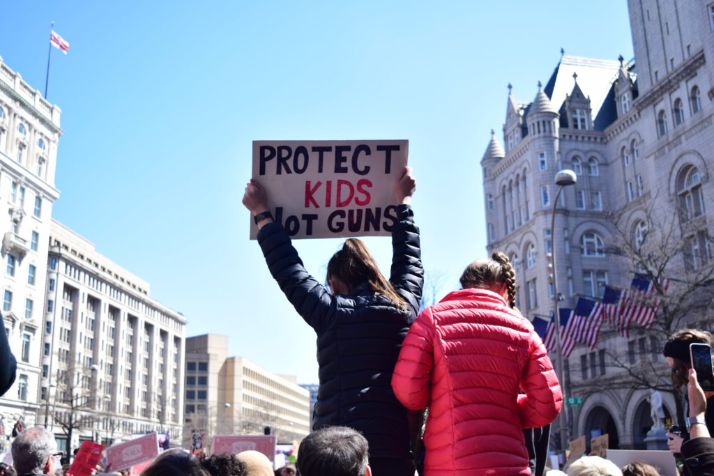 "Protect Kids Not Guns" protest sign.